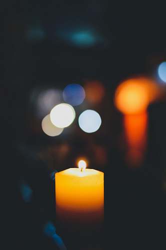 new delhi selective focus photography of lighted yellow candle india